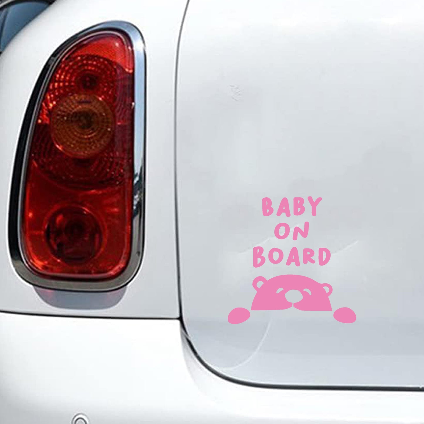 Baby bear peeking car decal, pink nursery-style accessory for parents.
