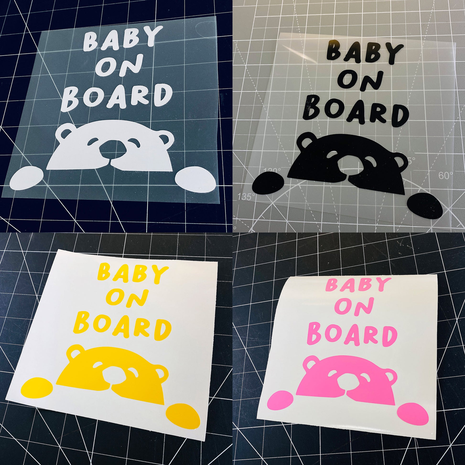 Four 'Baby on Board' signs in different colors on a grid background